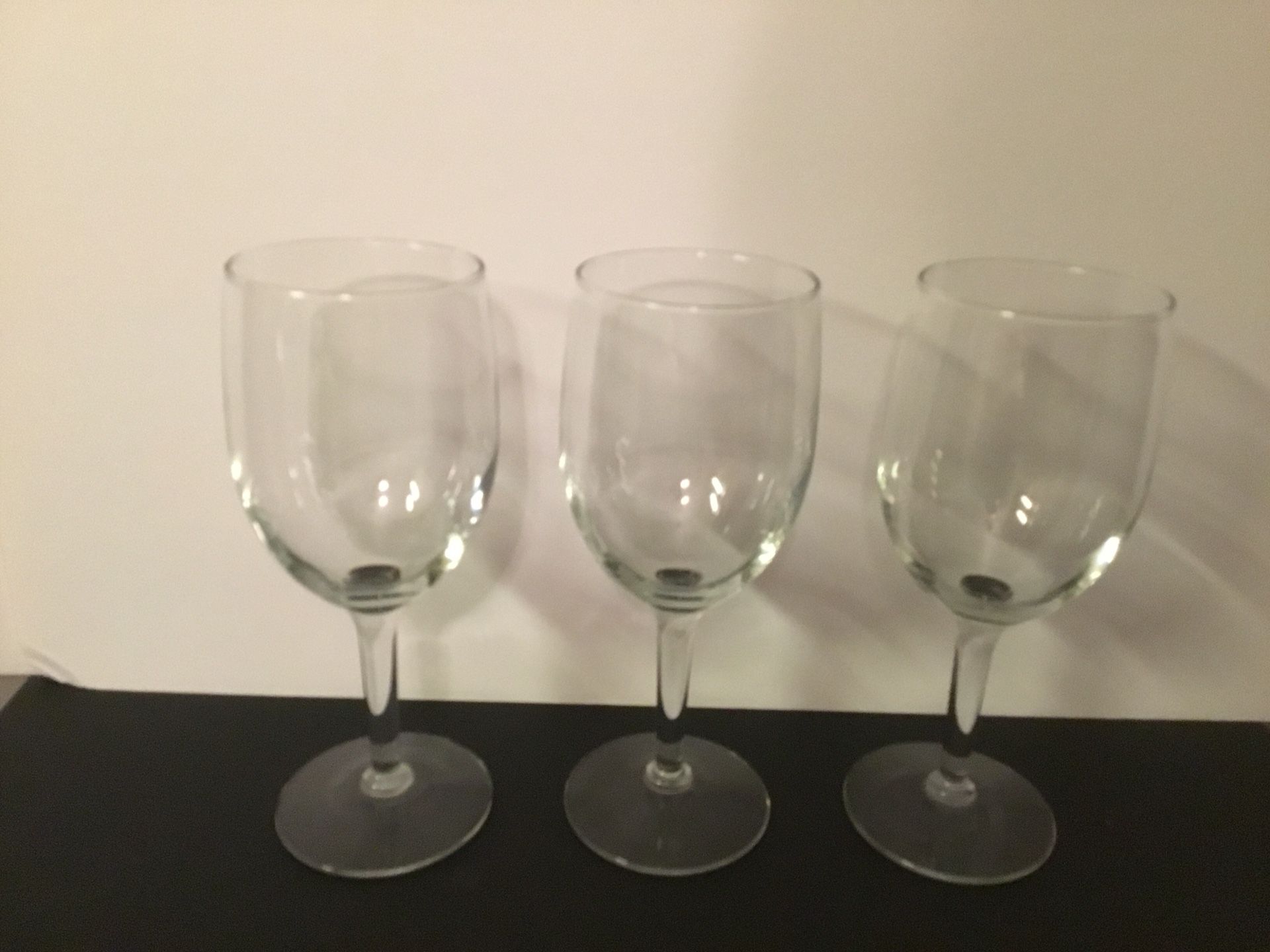 Three matching wine glasses