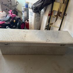 Aluminum diamond-plate truck bed toolbox.