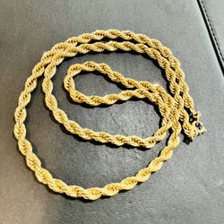 Rope  chain necklace gold tone. On the thicker side of rope chains. Approximately 23 inches in length. As is. No returns. What you see is what you get