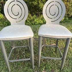 metal spiral chair gray with cream seat. These  solid contemporary chairs are in very good cosmetic condition with minor blemishes. Pickup address bel