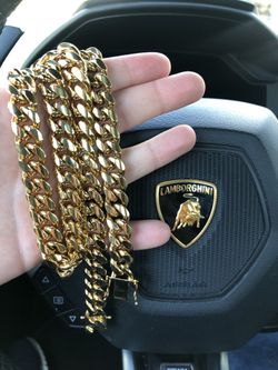 New 14 k yellow gold Cuban link chain and Cuban bracelet
