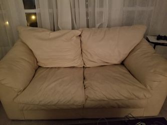 Cream colored leather couches