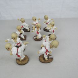 Lot of 10 Asian Boy Karate Form Figurines

