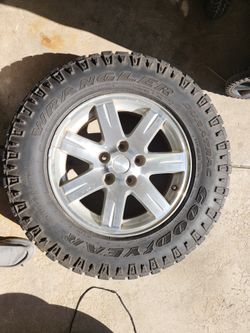 Used Goodyear wrangler tires & rims.
