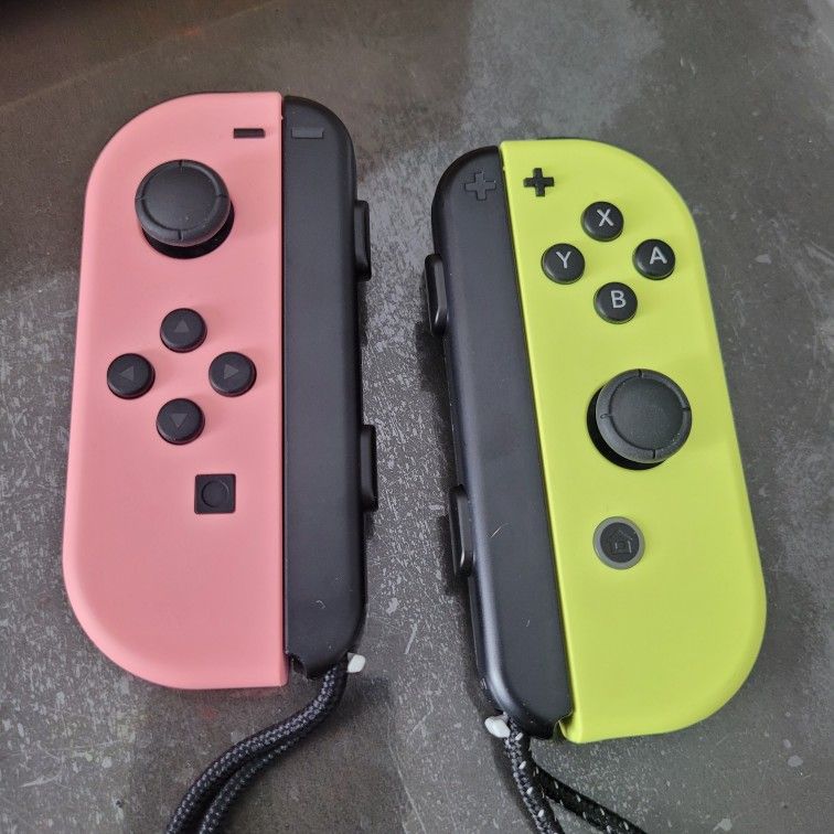 OFFICIAL NINTENDO SWITCH NEW COLORS PASTEL PINK AND YELLOW JOY CONS BRAND NEW CONDITION W/STRAPS