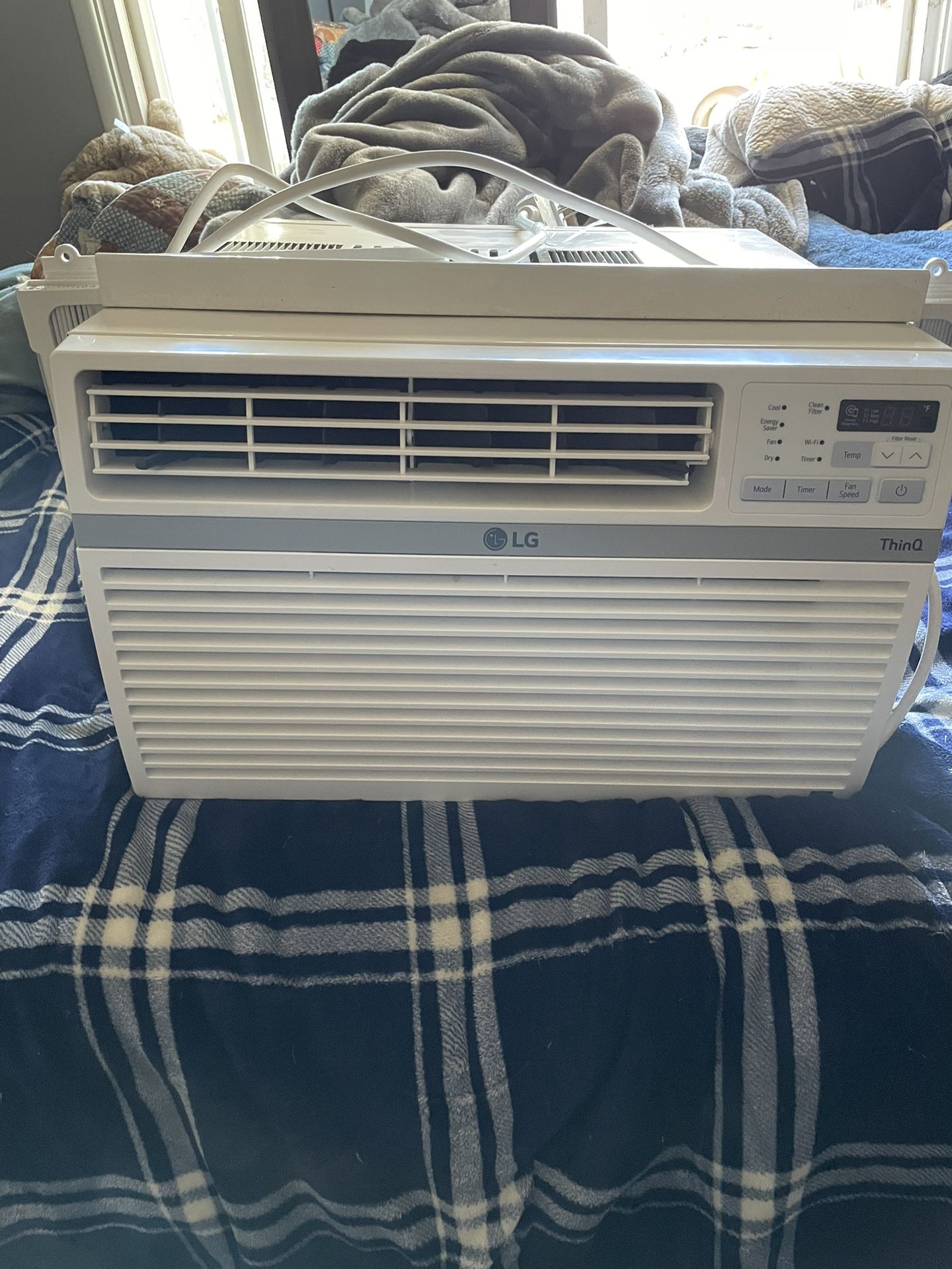 LG AC unit and it comes with remote 