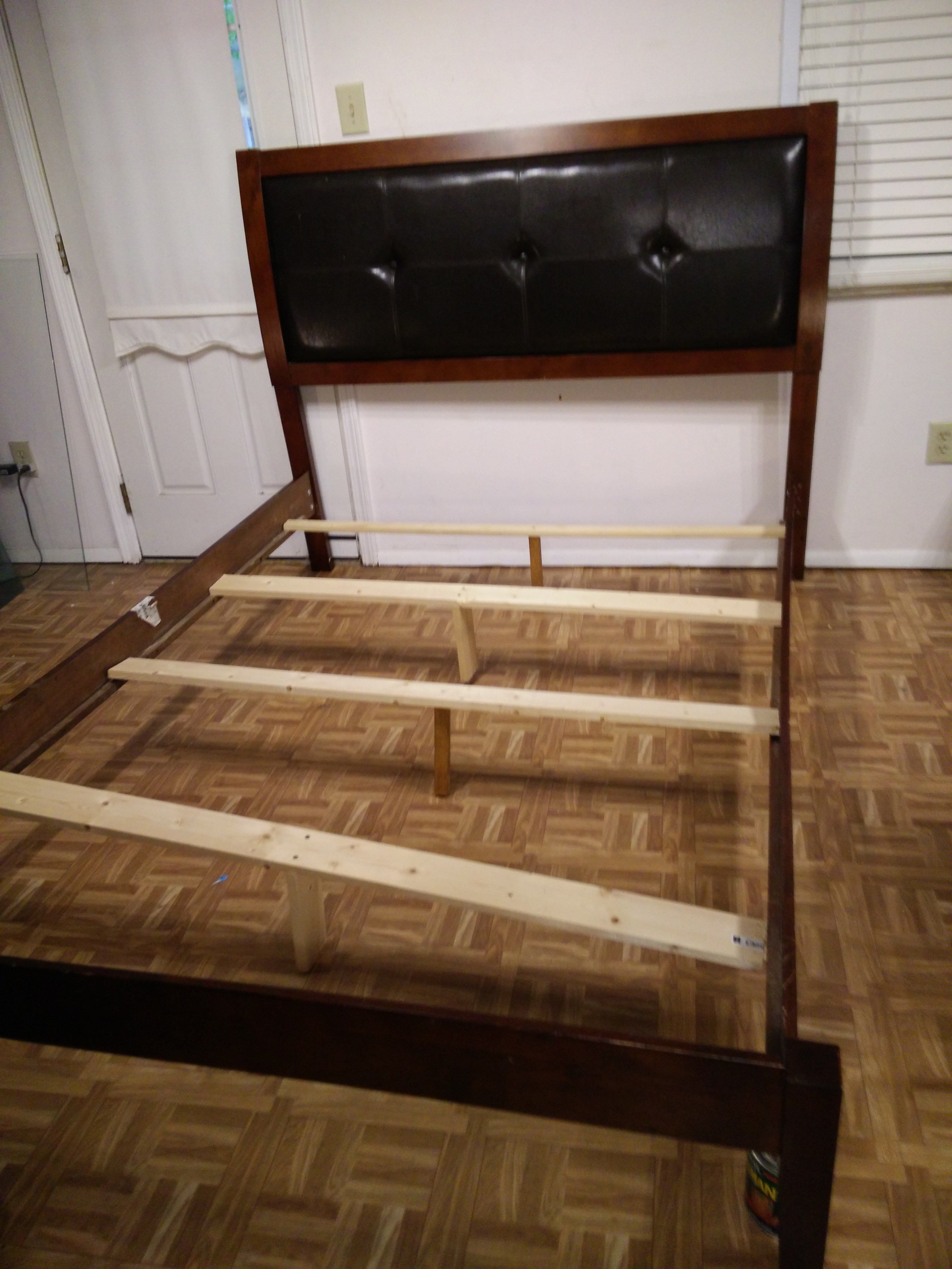 Nice wood queen bed frame with lather head board in very good condition,