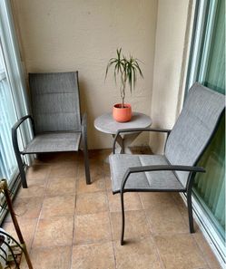 2 weatherproof, patio chairs, and matching table