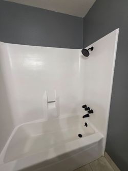 White Tub Shower Combo with Black Fixtures