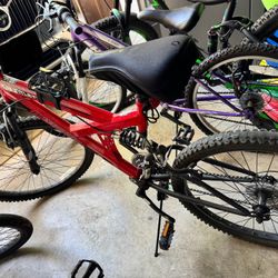 Youth Mountain Bikes One Red, One Purple 