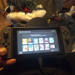 Nintendo Switch with w/controllers, charger, and station