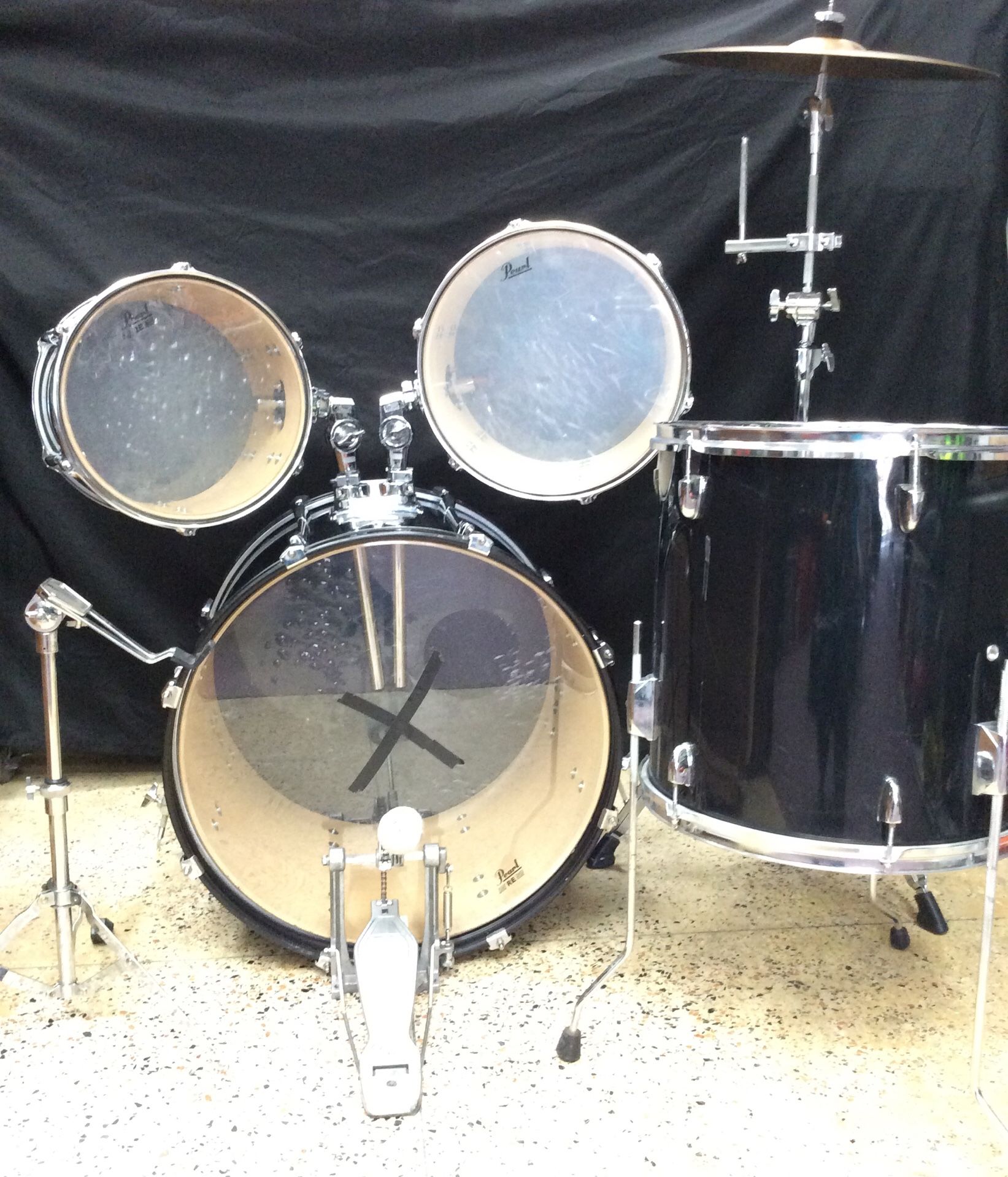 Pearl Drum Set including Pearl Foot pedal, 18” Sabain Crash Ride Cymbal on Pear stand, High, Mid and Floor Tom. Snare stand, no snare though.