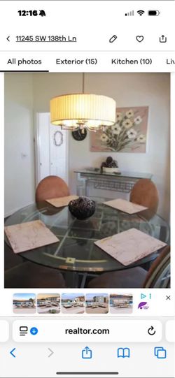 Glass top table 4 light tan upholster round back chairs and glass top side bar wine holder table can be used as a bar
