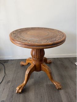 Wooden lion’s foot table