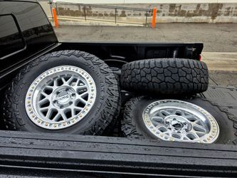 18" KMC w- 34" Falken Wildpeak RT tires. $1500