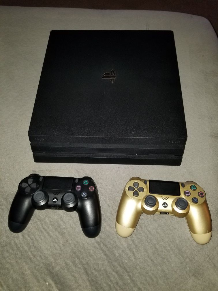 PS4 Pro bundle w/ two controllers and 4 games