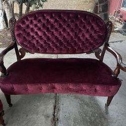 Victorian-style Loveseat With A Dark Wood Frame And A Side Chair 