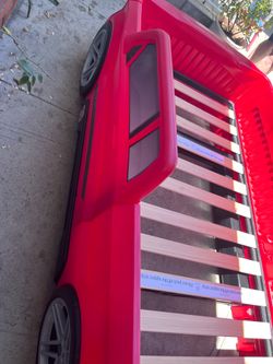Used kids car bed , fitsTwin size mattress