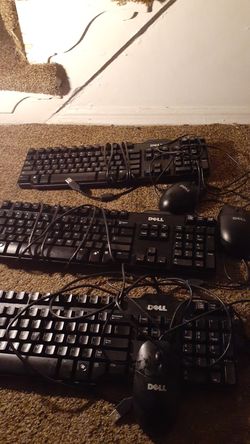 Three dell keyboards and mouses
