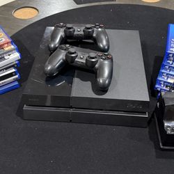 Playstation4 console, 2 controllers, 1 charger and 14 games