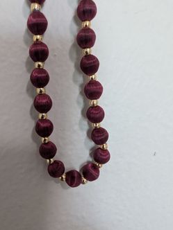 14.5" length burgundy and gold tone necklace maybe like silk beeds