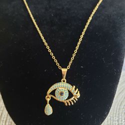 High Quality Gold Evil Eye Pendant With Blue Zirconia Stones...20 Inches Long Chain 