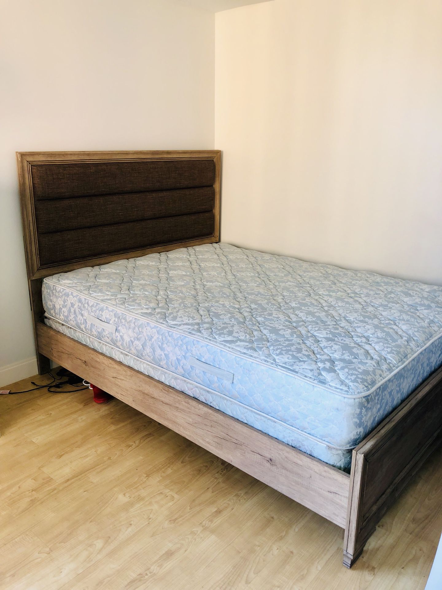 Queen sized bed frame and mattress for sale.