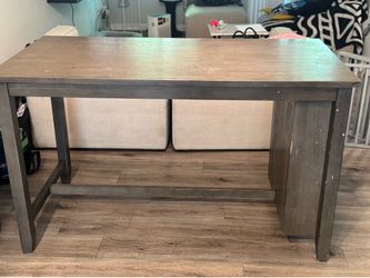 Dark gray  kitchen table with shelves and stools