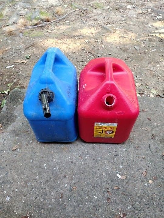 Two 5 gallon cans
