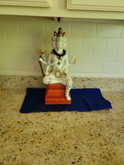 Figurine.  Missing an item on one of hands