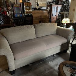 Beige Corduroy  90” sofa with cushion protector.