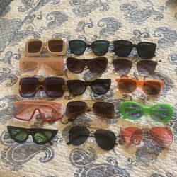 15 pairs of sunglasses most never used