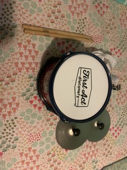 First act drum set (cymbals ,drum,drum sticks and a strap to hold the drum