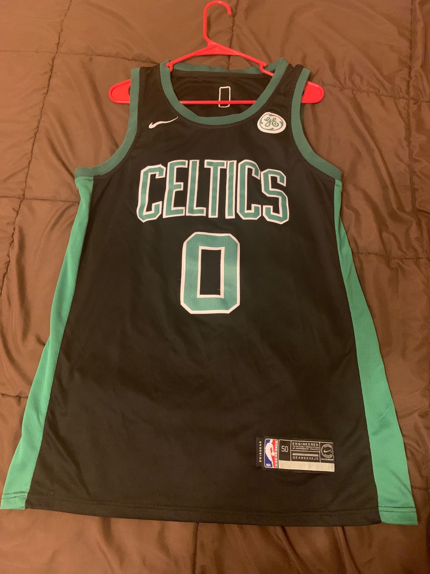 Jason Tatum #0 Celtics jersey.