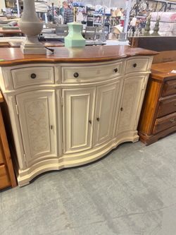 Cream colored tall buffet sideboard (in store)