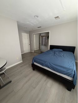 Queen bed with frame , mattress and mattress topper