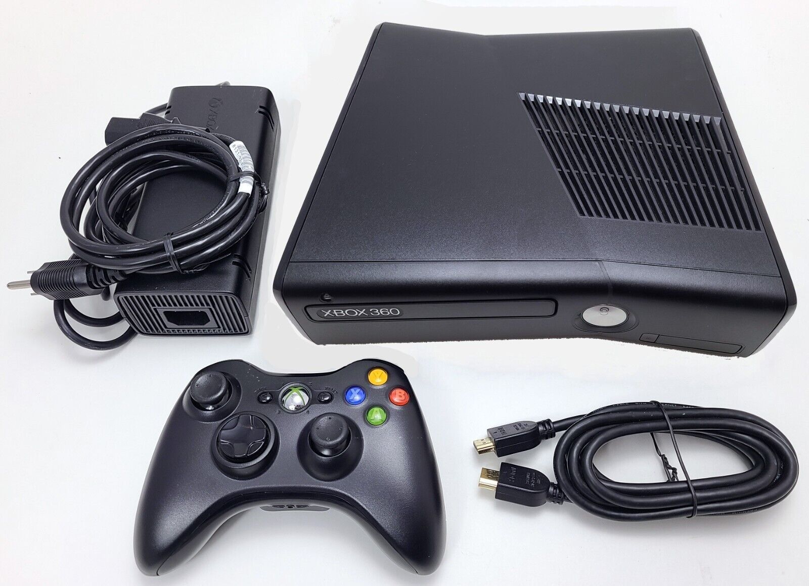 xbox 360 slim black with cables and controller