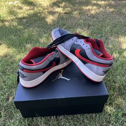 Red,gray, and black Jordan lows size 7