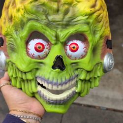 a green zombie/alien monster mask