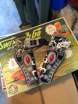 Vintage Hubley holster and one single shot cap gun