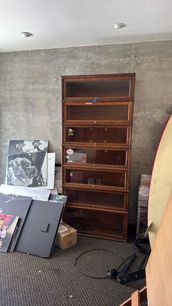 Tall wooden/glass display case