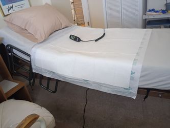 BARELY USED FULLY AUTOMATIC HOSPITAL BED