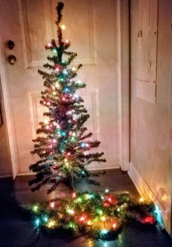 Prelit Christmas tree and garland