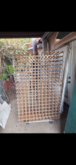 Modular solid pine wine rack with a massive capacity of approximately 450 bottles.