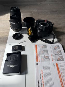 Nikon D3100 camera with two lenses