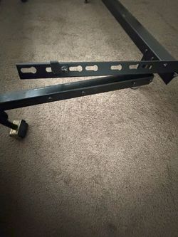 Adjustable metal bed frame on wheels
