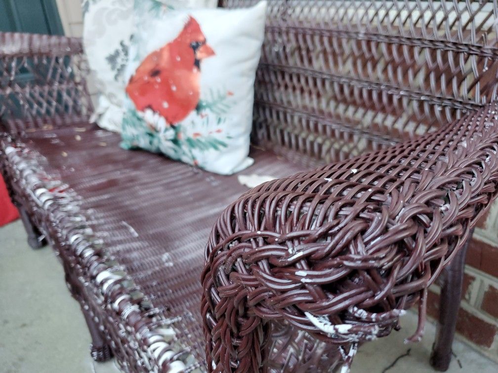 Brown wicker bench (outdoor patio)