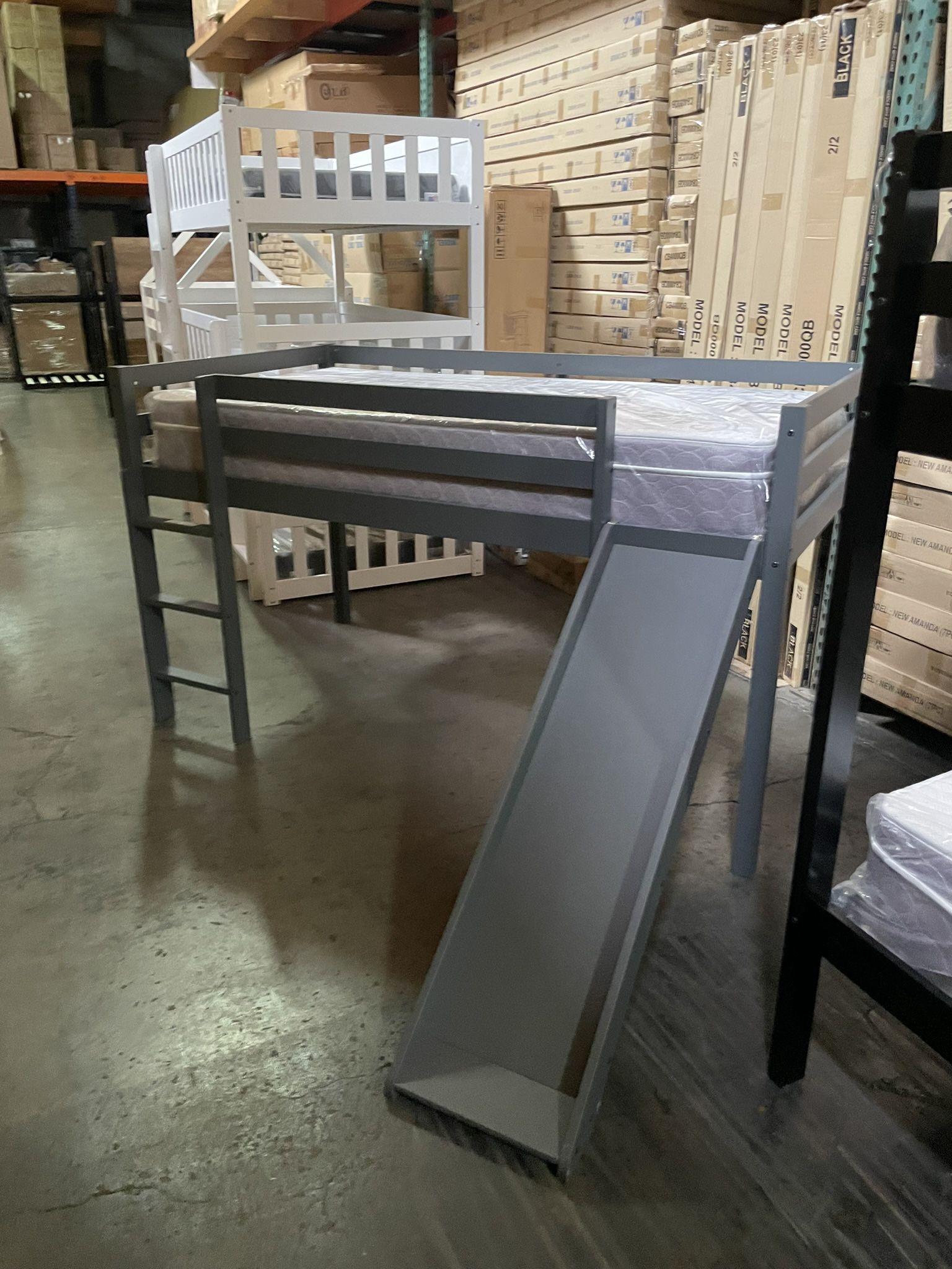 Twin bed with slide. Available in grey&white. Assembly required. Assembly not included. Tax included. Free delivery. Bed only $280 Bed with mattress