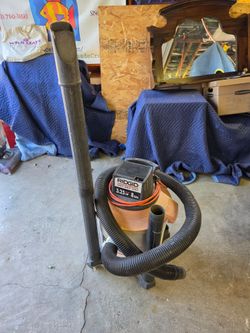 RIDGID Wet/Dry Shop Vacuum with a 3.25 peak HP motor and an 8-gallon brown canister