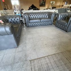 Traditional gray tufted faux leather sofa love and chair